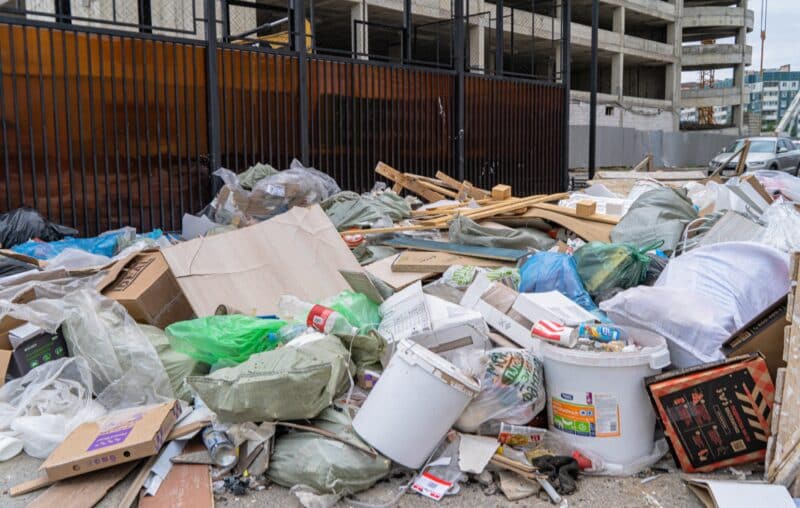 Construction waste and debris along demolition site