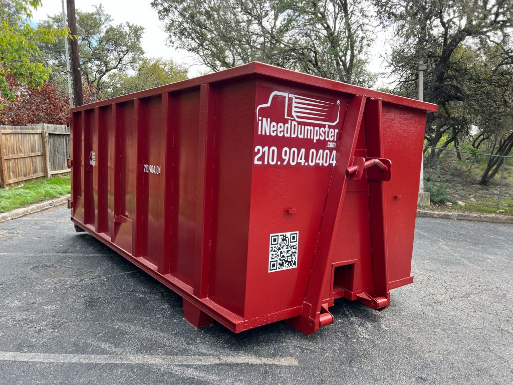 30-yard dumpster sitting outside of a commercial warehouse for commercial removal services