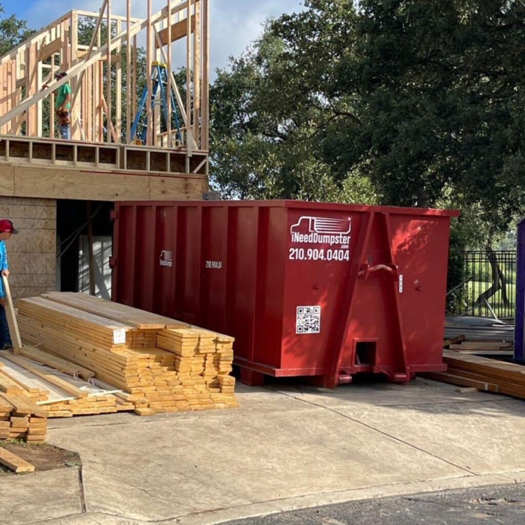 I Need Dumpster dumpster for rental parked at a construction site in San Antonio